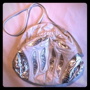 Antique white leather with silver leaves.